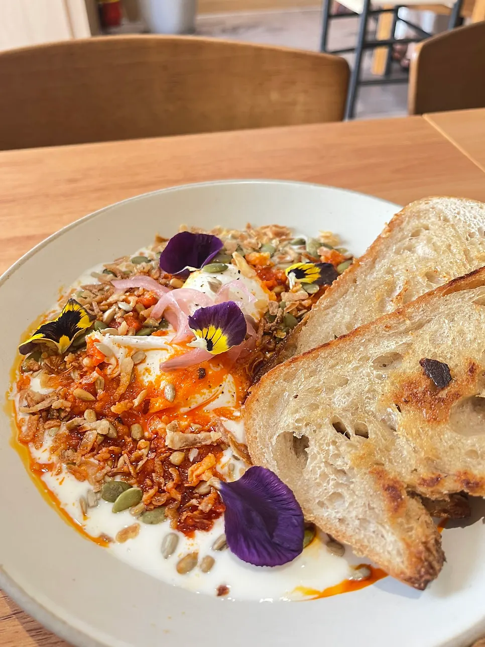 Plate topped with chili garlic butter and mixed seeds