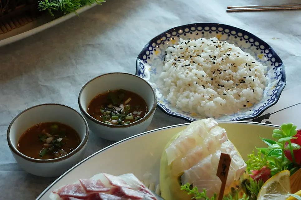 Thick assorted sashimi served on a stone