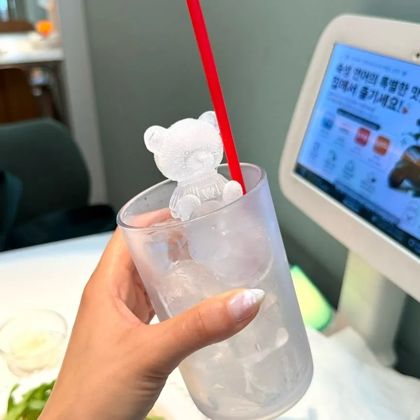 Grapefruit soda with a bear-shaped ice cube