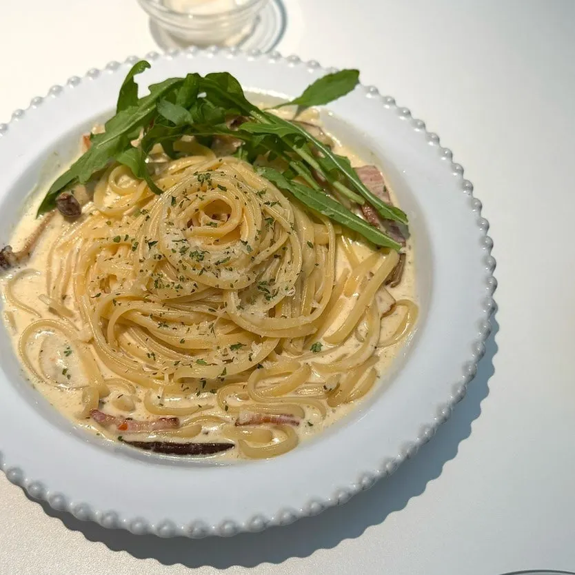 Pasta noodles coated in cream sauce