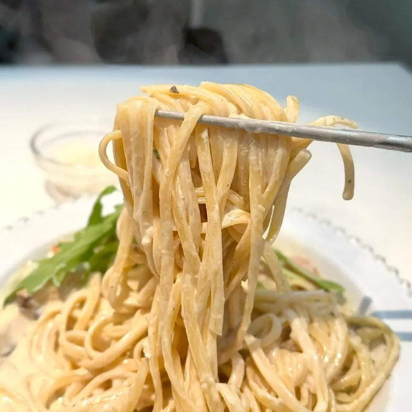 Truffle cream pasta twirled around a fork