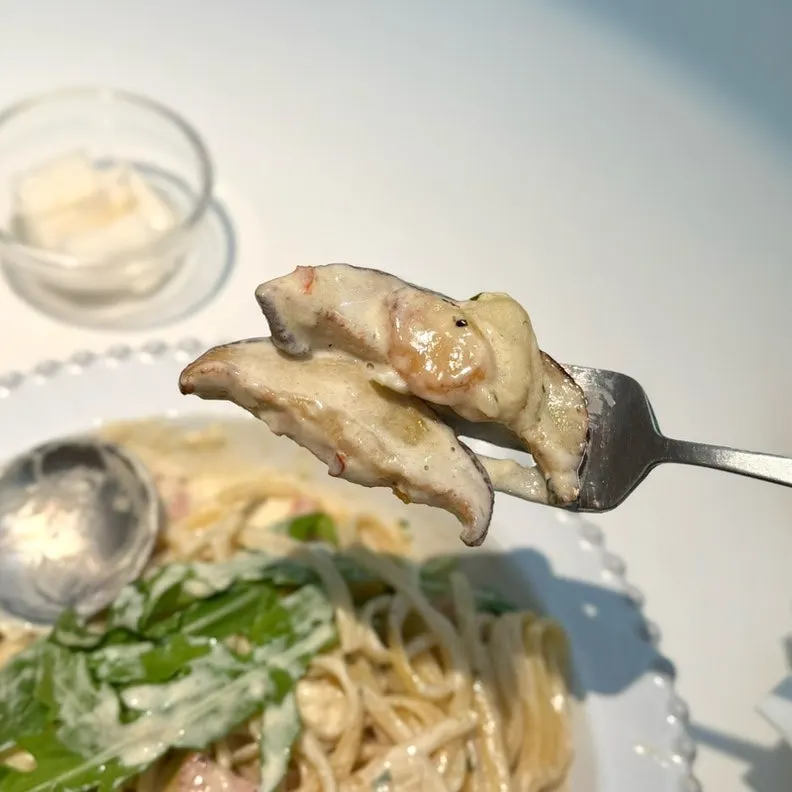 Cream pasta topped with mushrooms