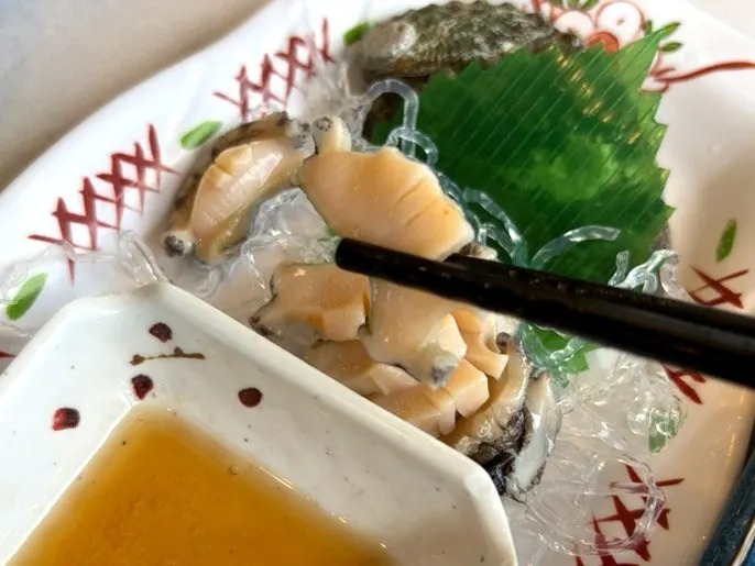 Warm buttered abalone served