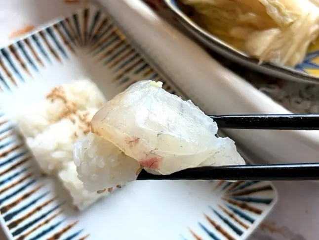 Plate of thickly sliced assorted sashimi