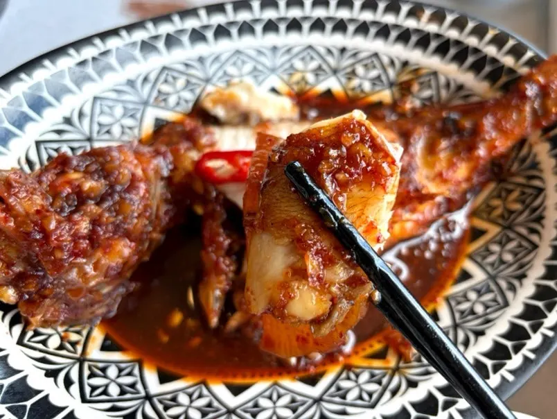 Spicy crab stew served as a finishing dish