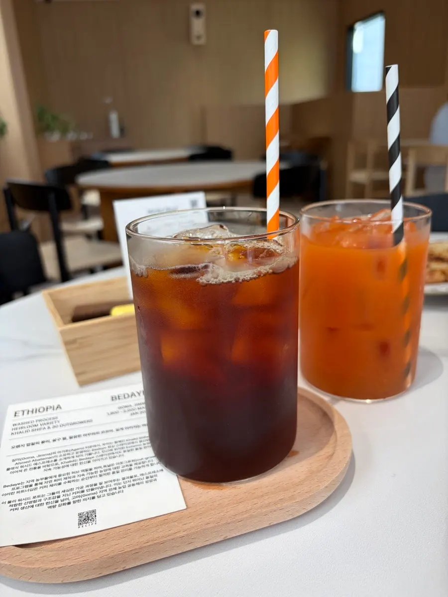 Table set with apple carrot juice and coffee