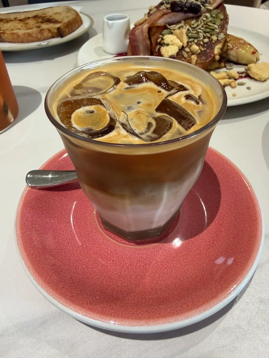 Drip coffee and flat white made with Deux beans