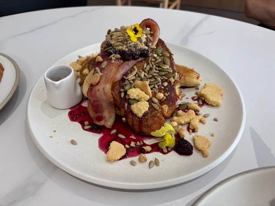 Table setting with Egg in Hell and sourdough