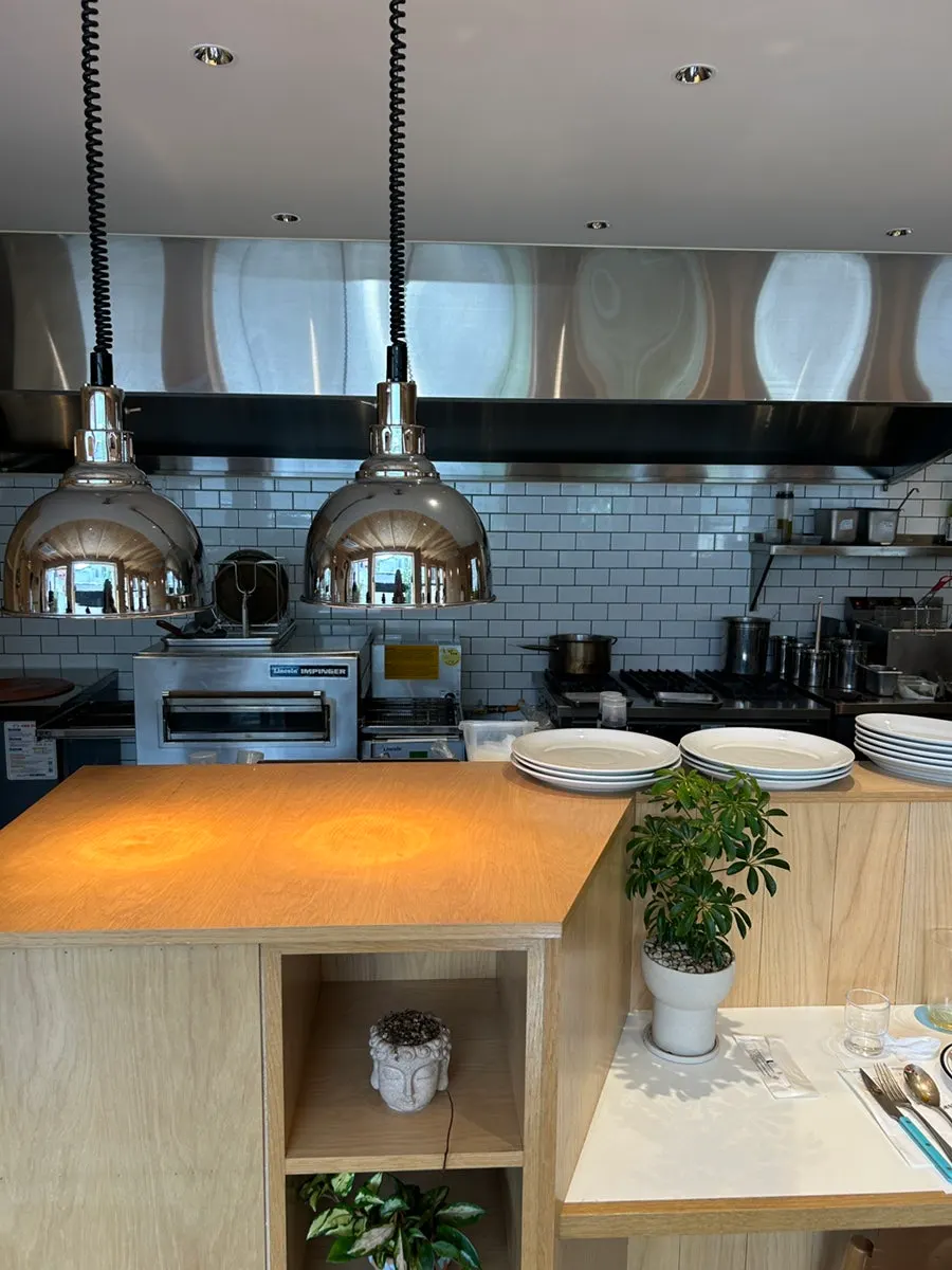Bar seating in front of the open kitchen
