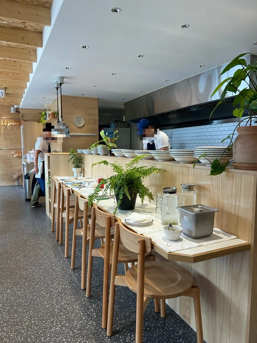 Seating near Extra Mile's open kitchen