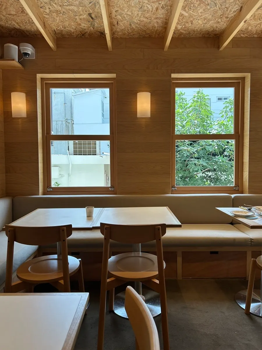 Sunlit two-seat table area toward the back