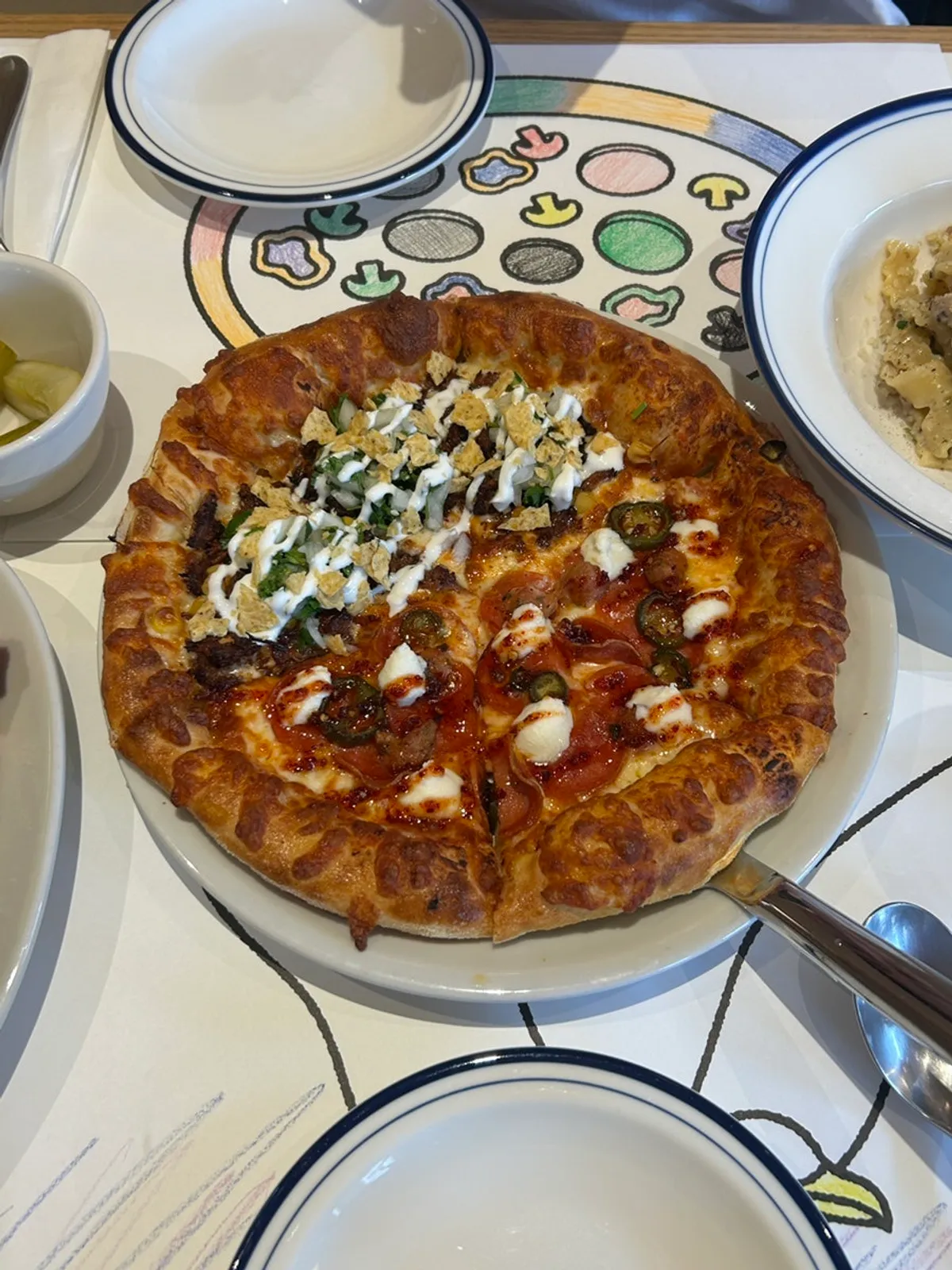 Half-and-half pizza with birria taco and hot honey pepperoni