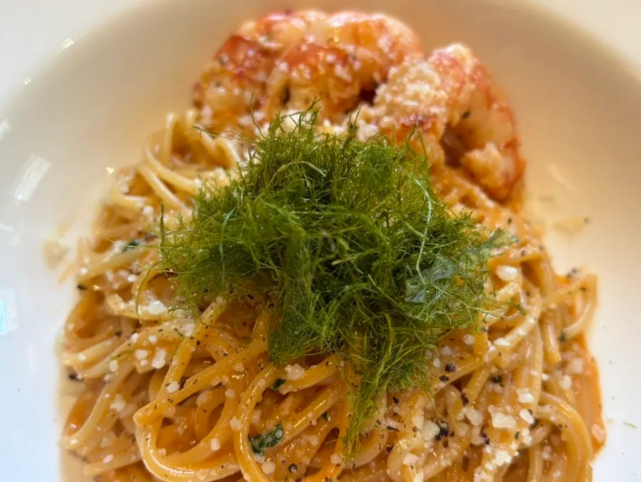 Bisque cream pasta topped with shrimp and gimtae
