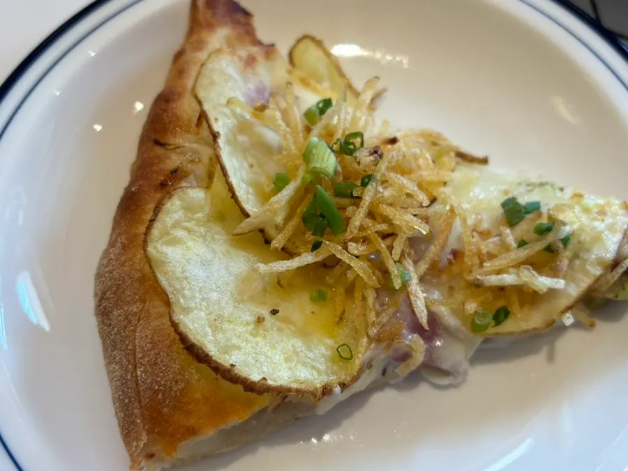 Cross-section of a slice of potato pizza