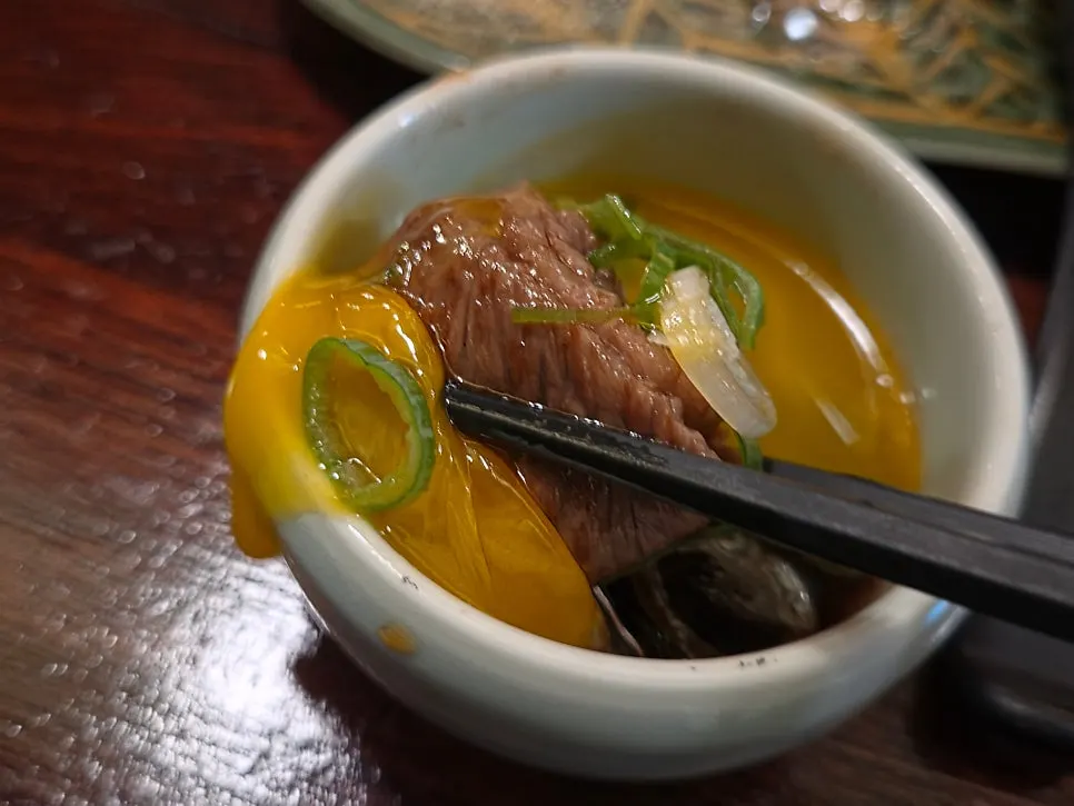 Yakiniku dipped into the special sauce