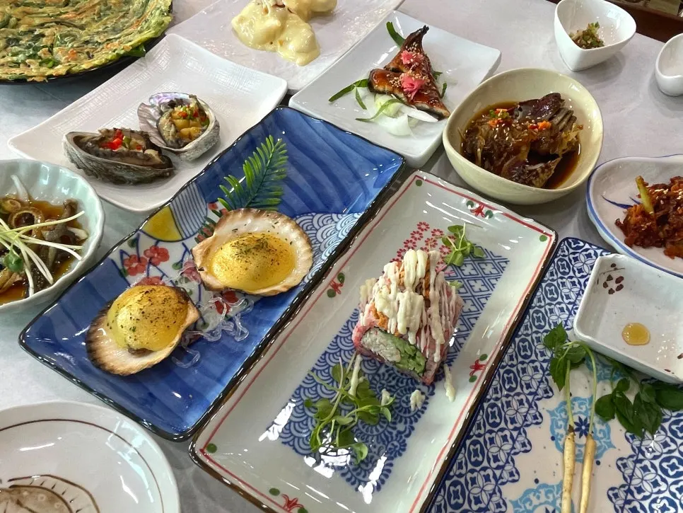 Table set with abalone and grilled eel