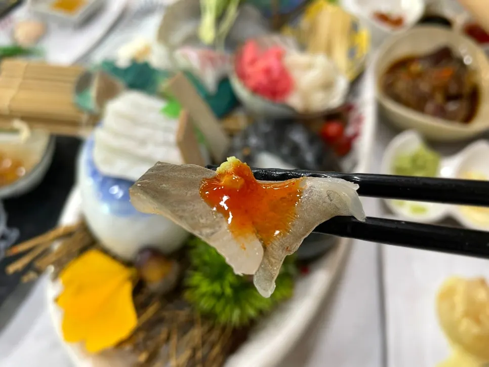 Sashimi placed over sushi rice