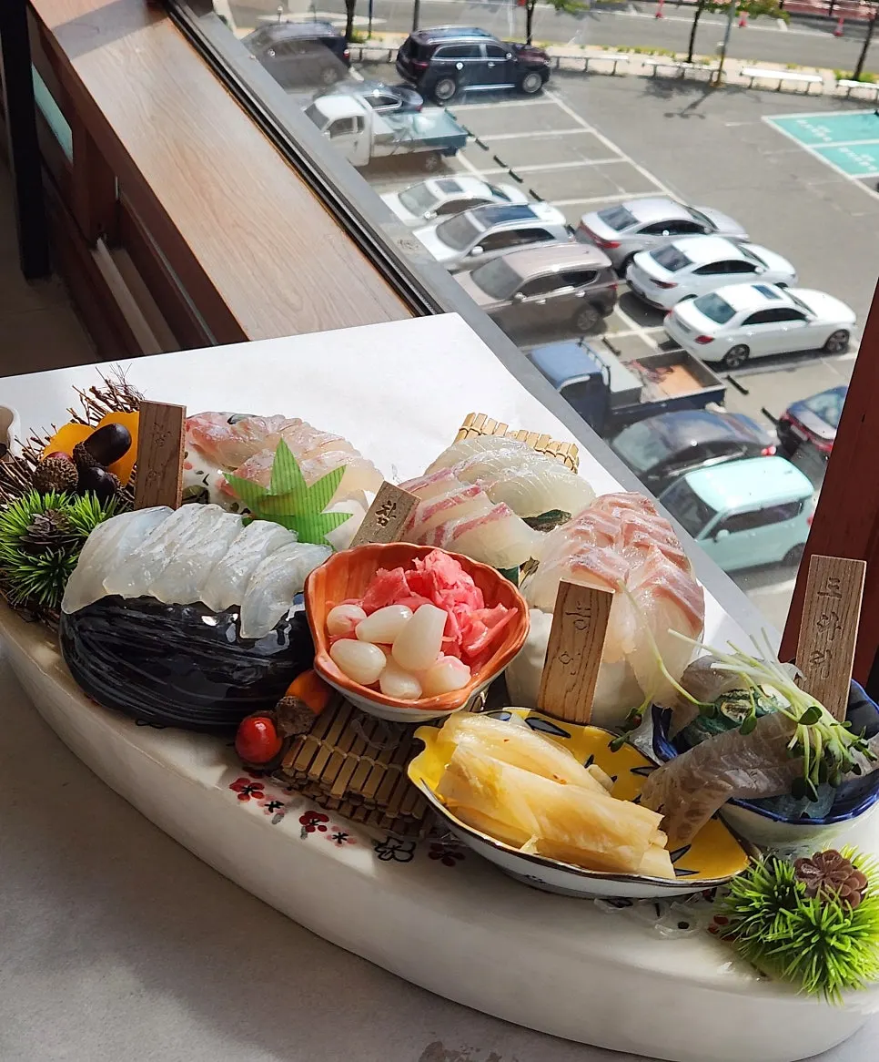 Assorted sashimi of red seabream, sea bass, flatfish, and flounder