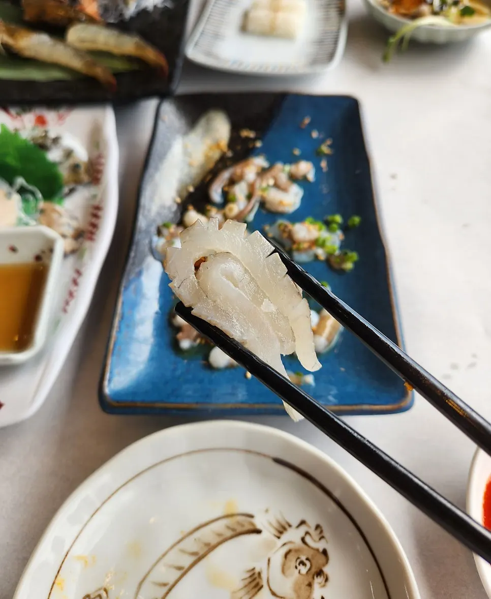 Thick-cut live-fish sashimi with aged kimchi and radish sprouts