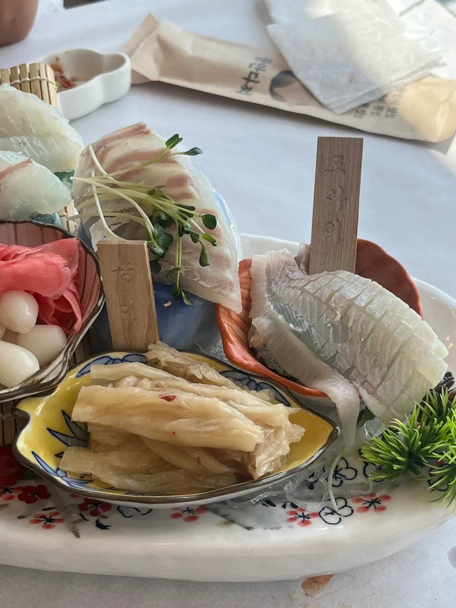 Assorted sashimi of flatfish, sea bass, spotted flounder, and red seabream