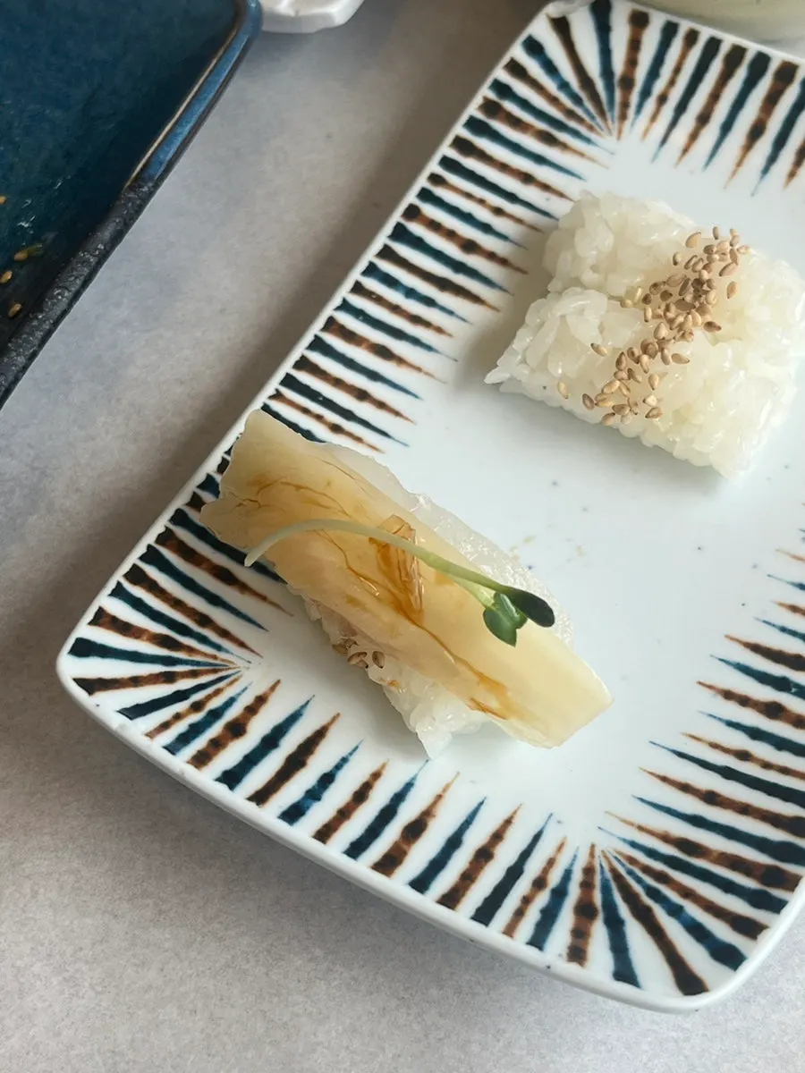 Assorted sashimi platter served with aged kimchi