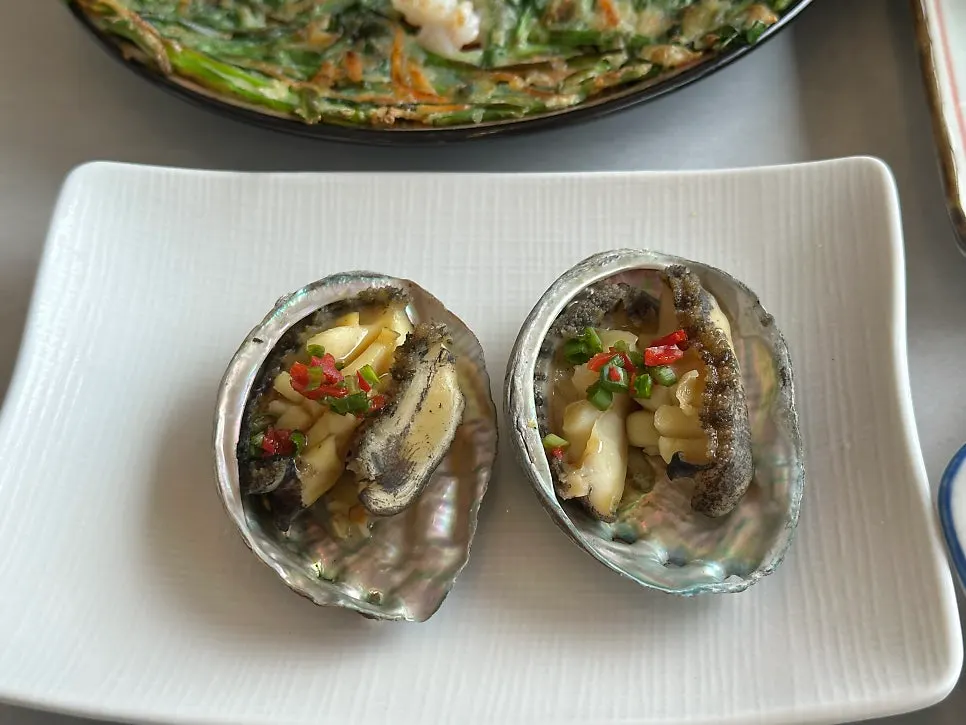 Warm cooked abalone dish