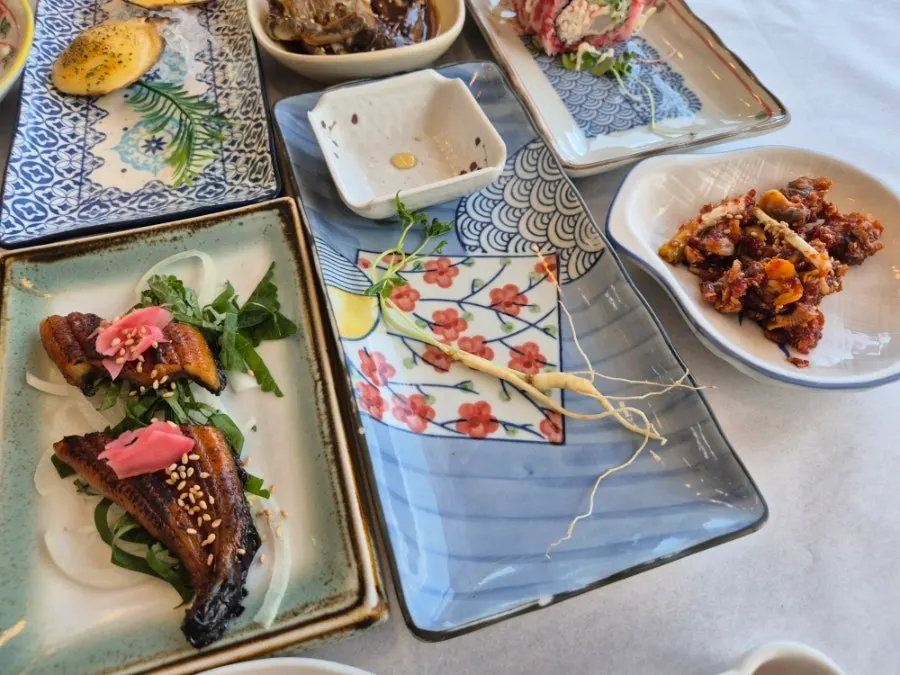 Sundries spread including soy-marinated crab and cockle mix