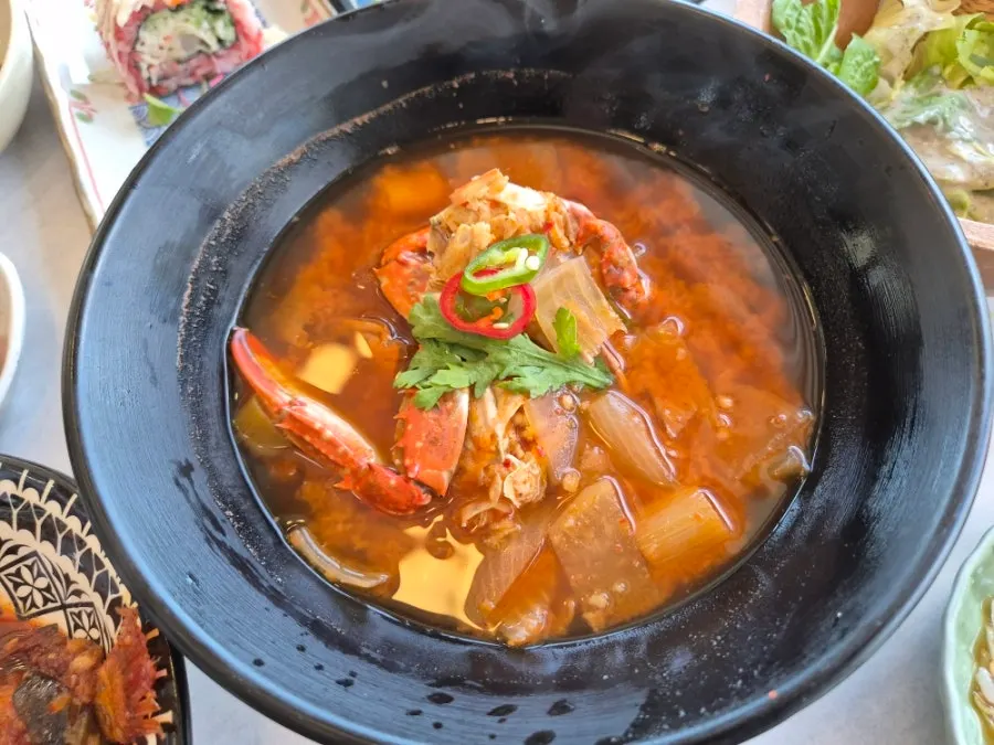 A bubbling pot of crab stew