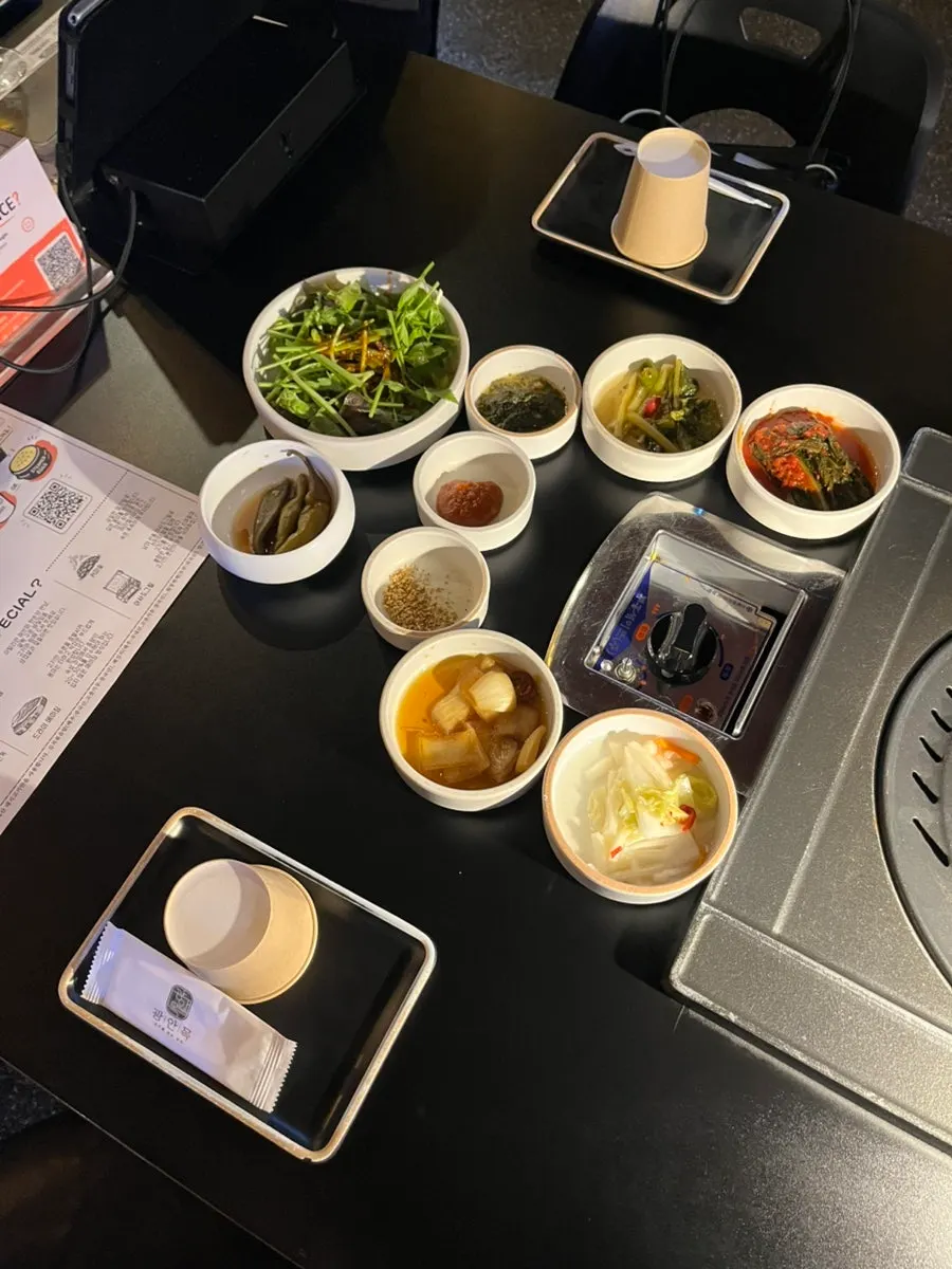 Full spread of banchan set on the table at Gwangan-mok