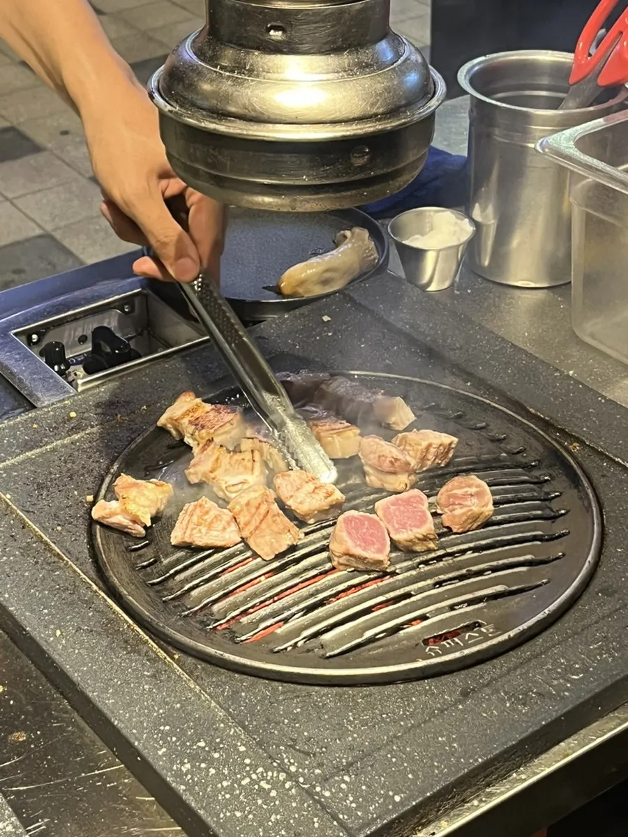 Pre-grilling in progress near the entrance