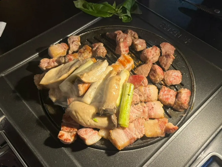 Close-up of the meat being grilled tableside