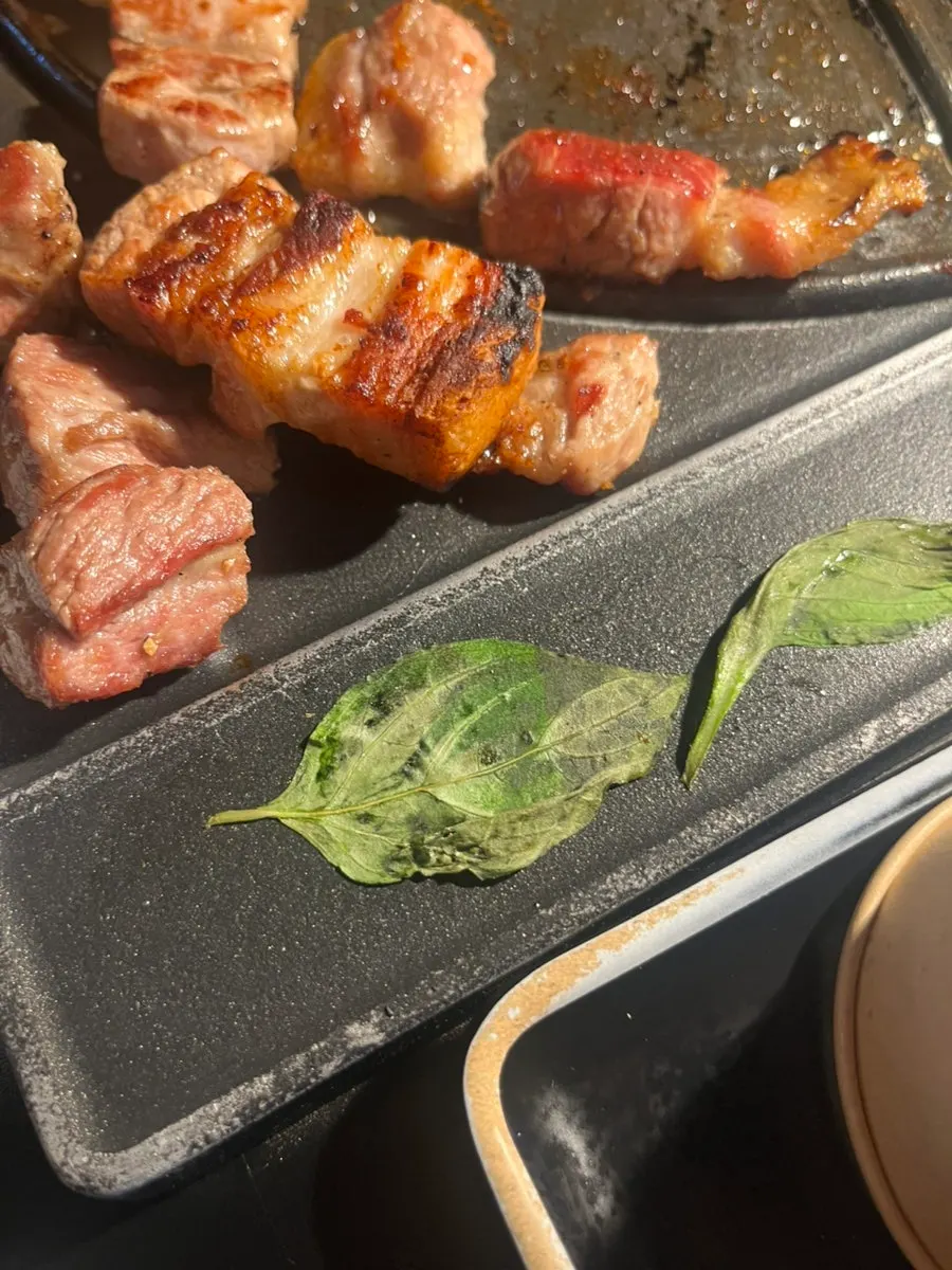 Grilled pork placed on a basil wrap