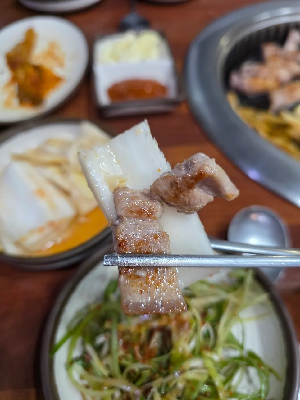 Table spread of meat and side dishes