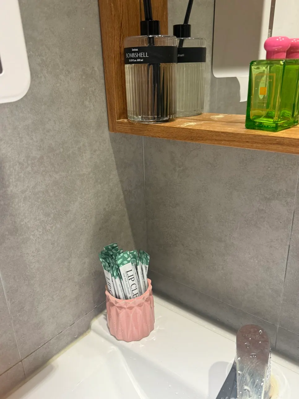 Bathroom sink with mouthwash provided