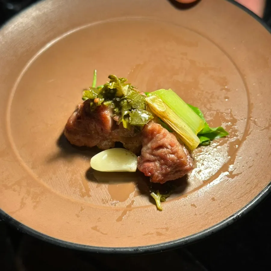 Pork belly and pickles wrapped in wild garlic leaves