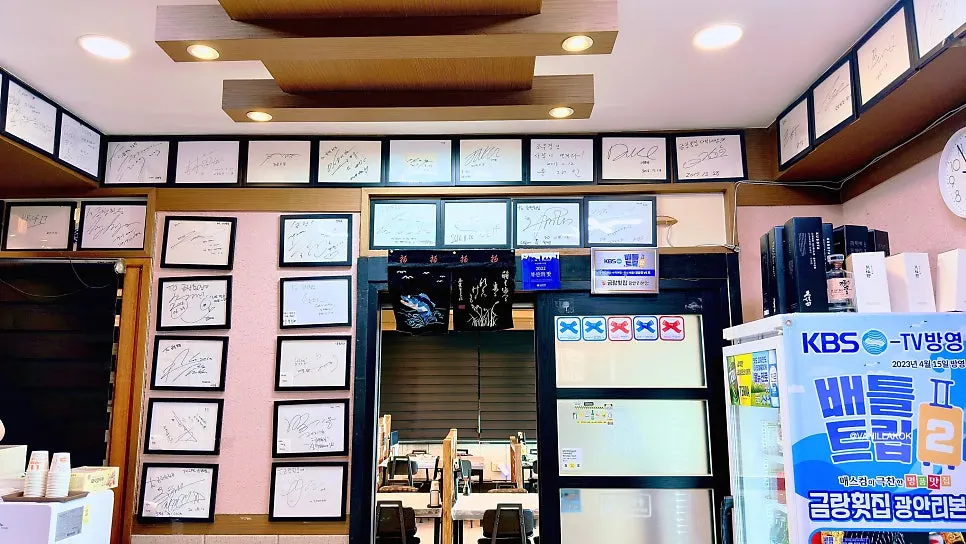 Inside the sashimi restaurant with framed autographs