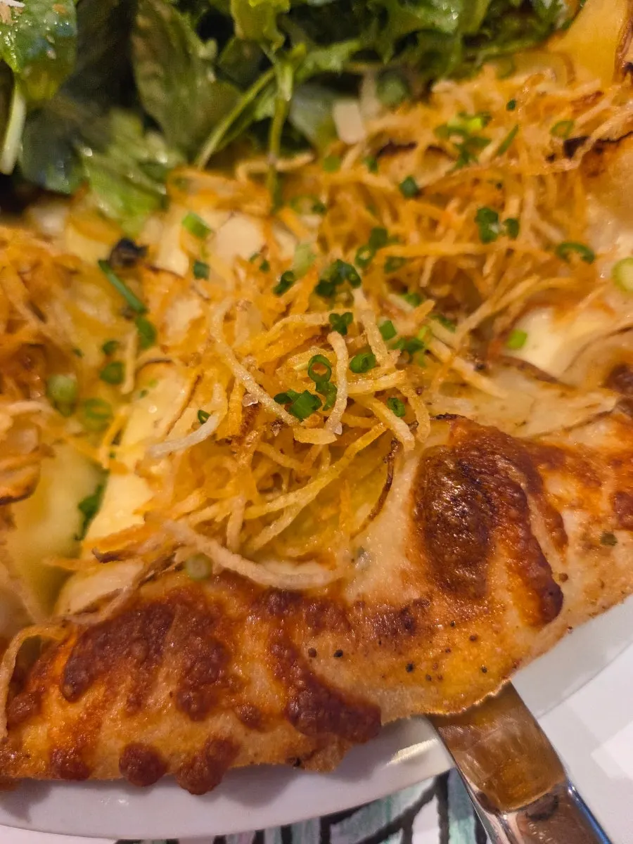 Potato pizza topped with bacon