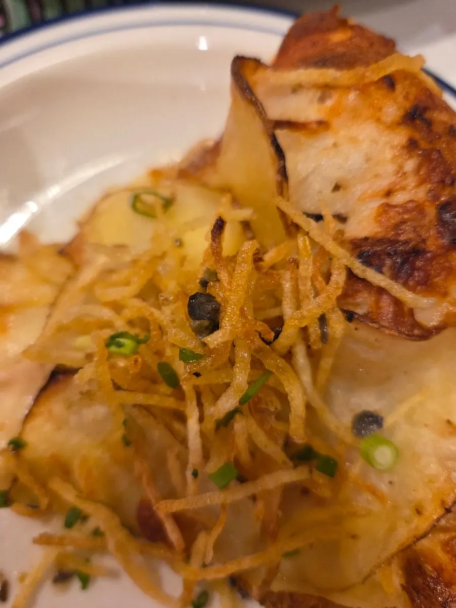 A slice of potato pizza