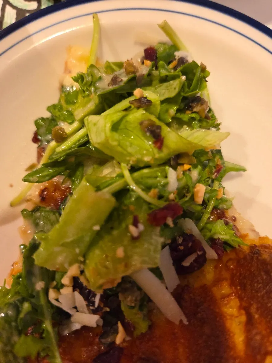 A slice of salad pizza