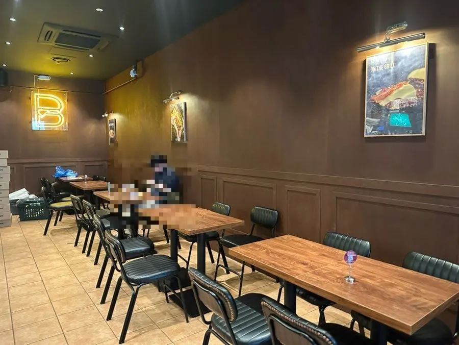 Order screen showing burgers and side menu items