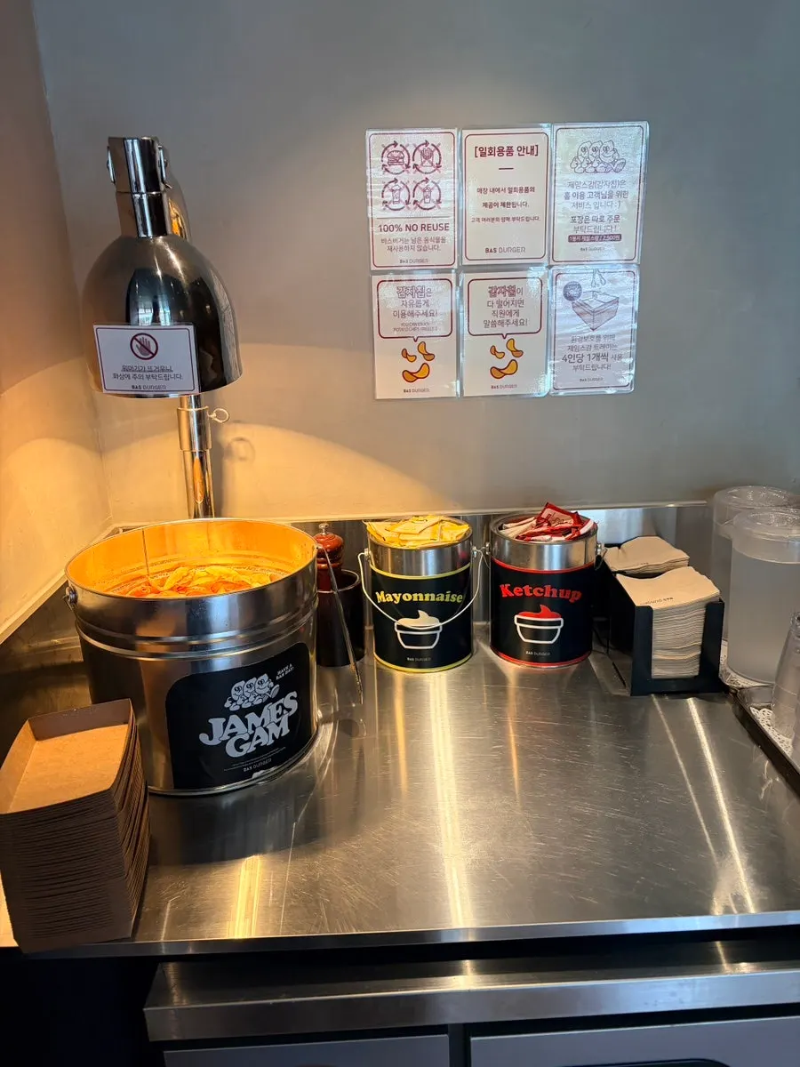 Self-bar corner with free potato chips at Base Burger