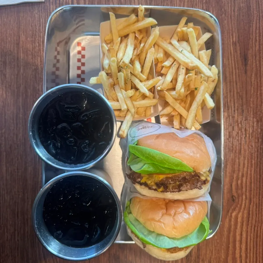 Two burgers placed on the table