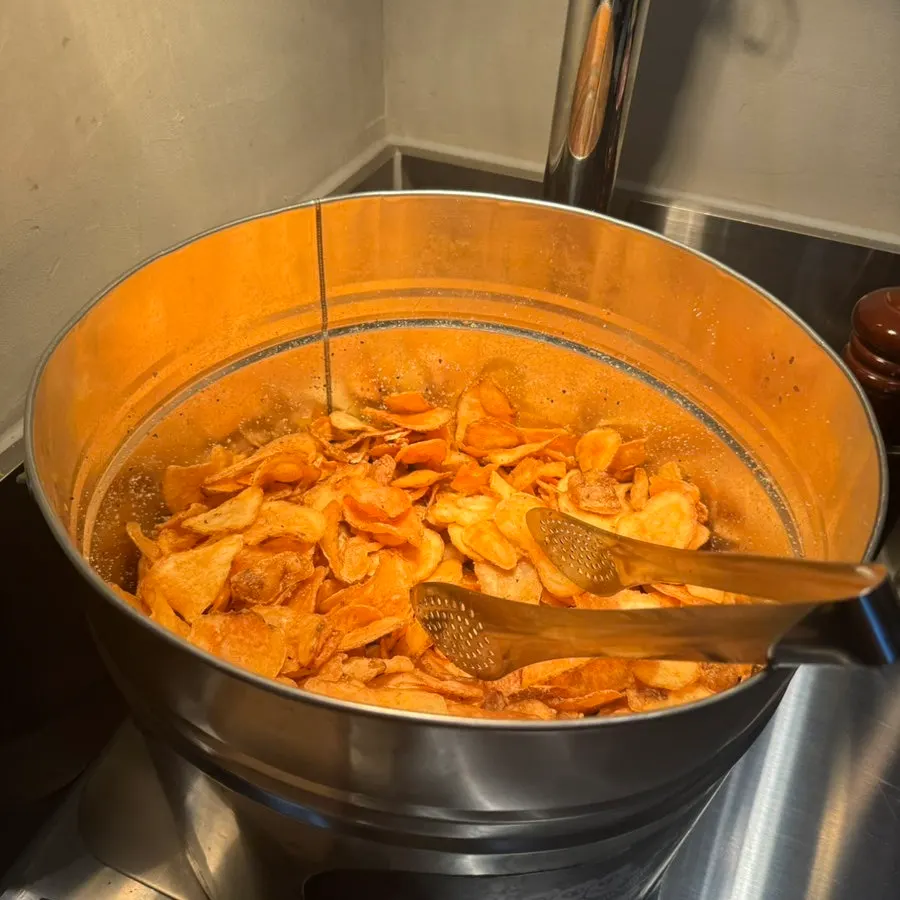 Free potato chips and sauces at the self bar