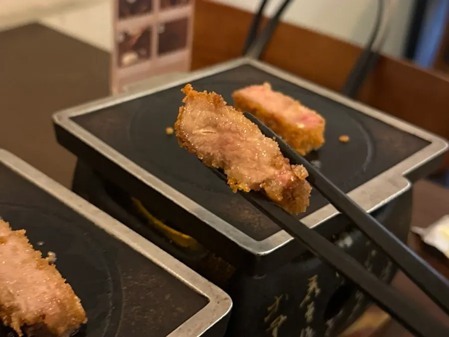 The first bite of gyukatsu dipped only in salt
