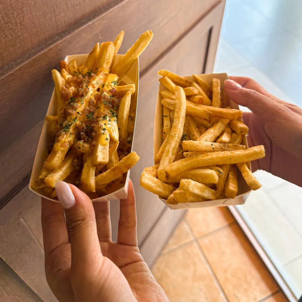 An assortment of sauces served alongside the burgers