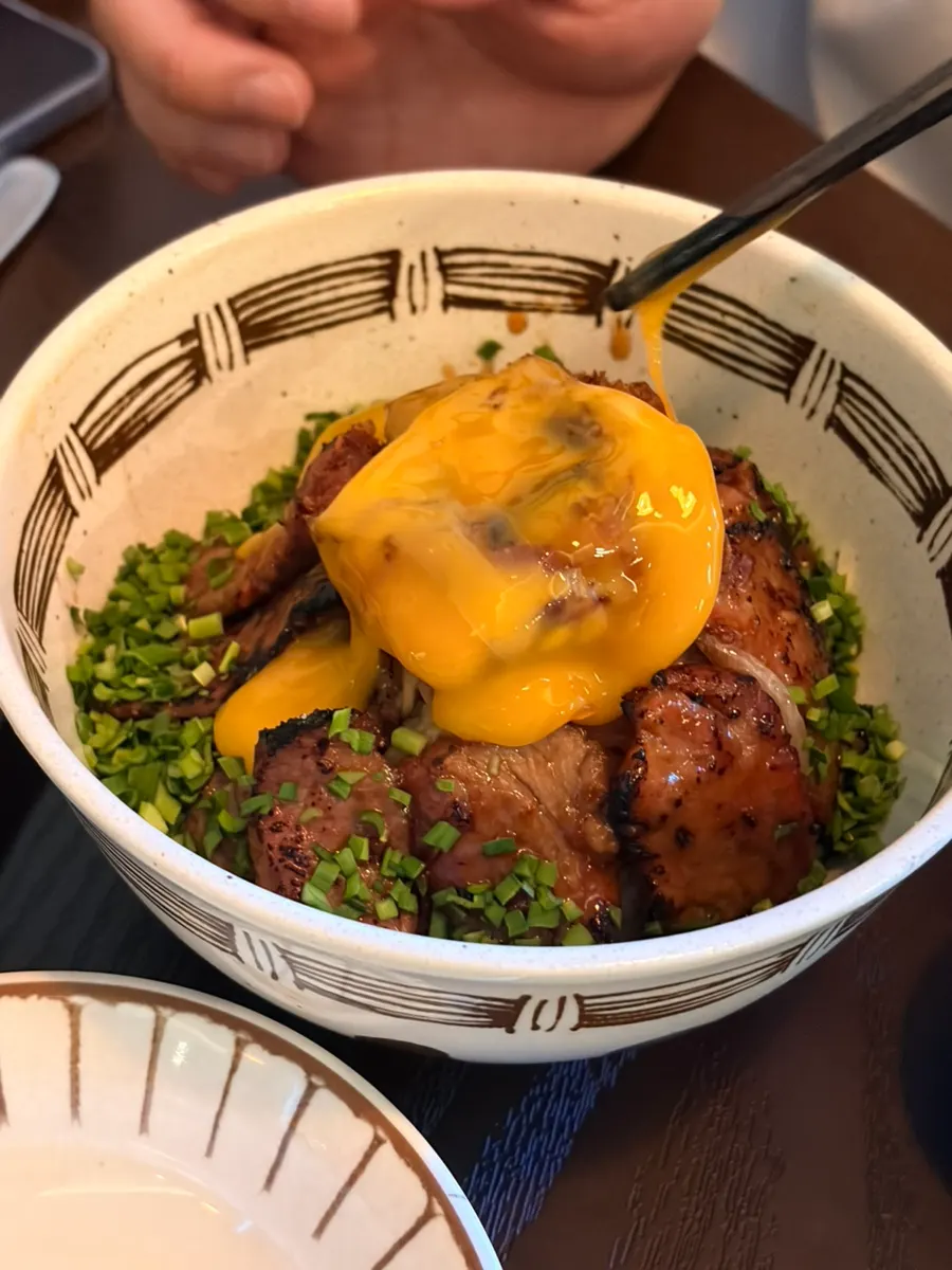A bite of beef topped with fresh wasabi
