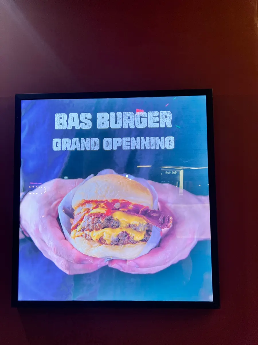 Deep brown-toned interior of Base Burger