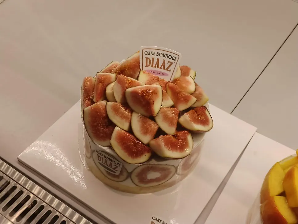 Rows of various slice cakes in the display case