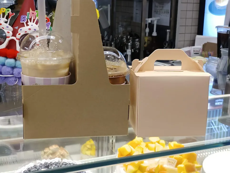Slice cake and drink packed in a carrier