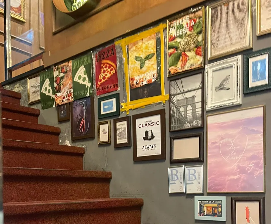Staircase passage lined with framed pictures